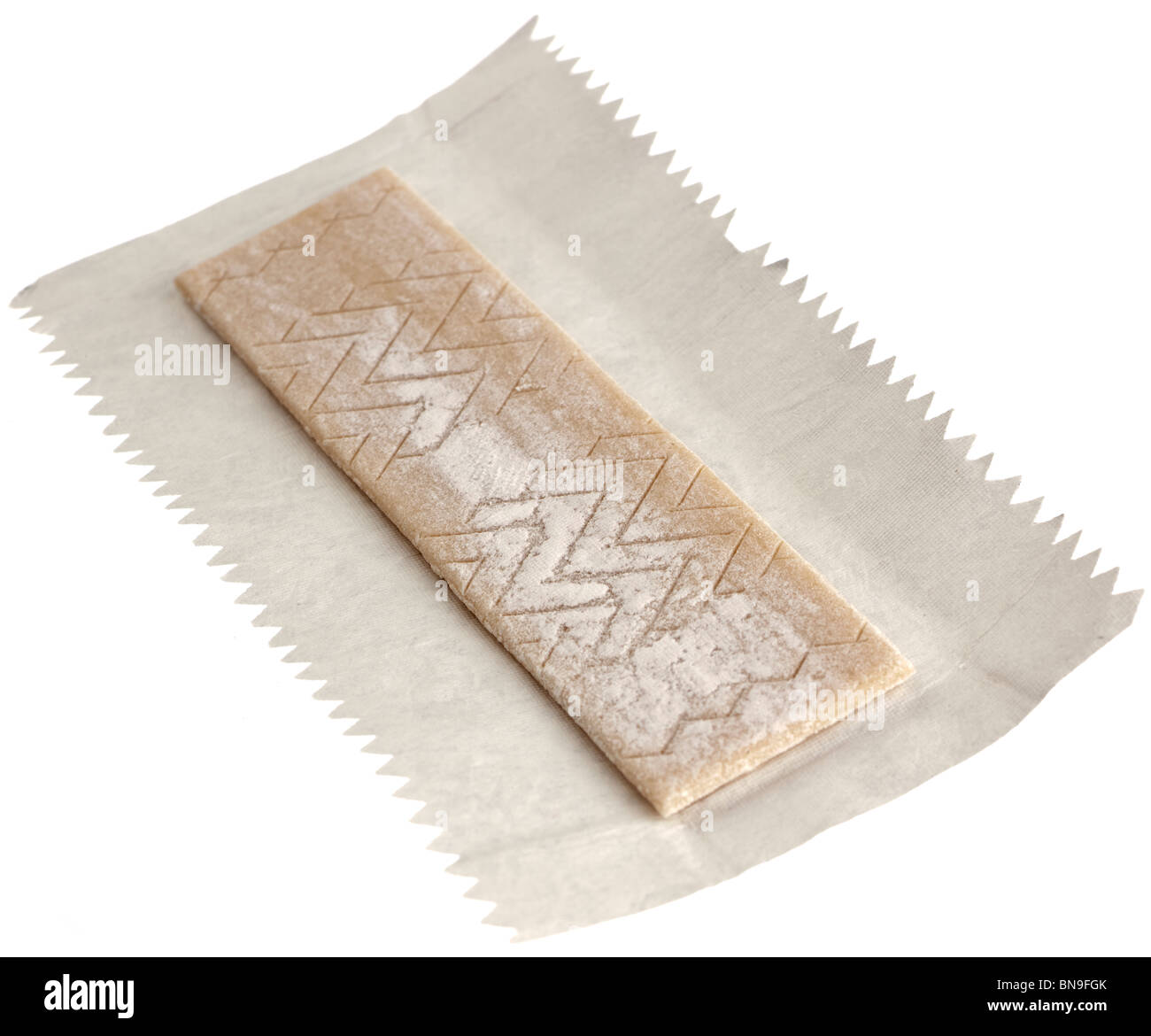 Piece of Wrigley's juicy fruit chewing gum and wrapper Stock Photo