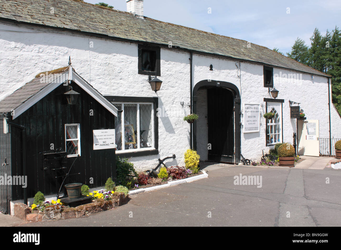 The Gretna Hall Blacksmith's shop in Gretna village, Scotland Stock Photo
