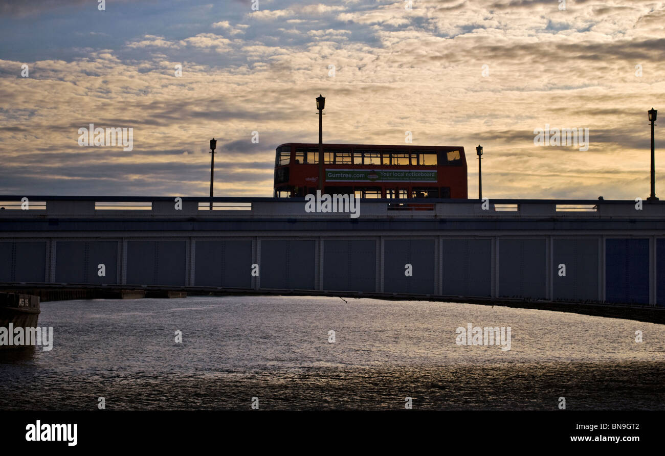 A bus following across the Wandsworth bridge (London) Stock Photo