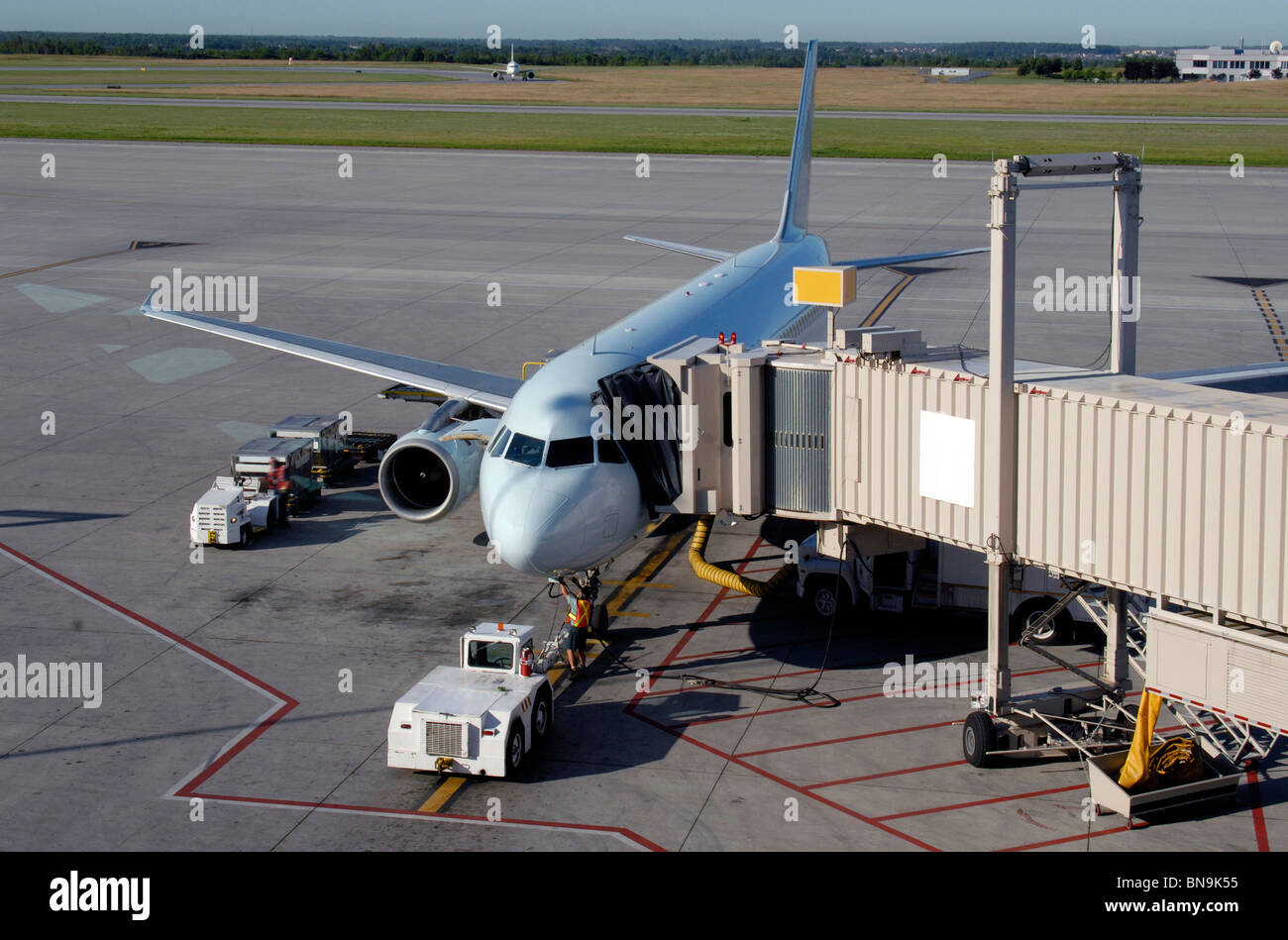 Passenger Jet Aircraft At The Loading Gate Stock Photo