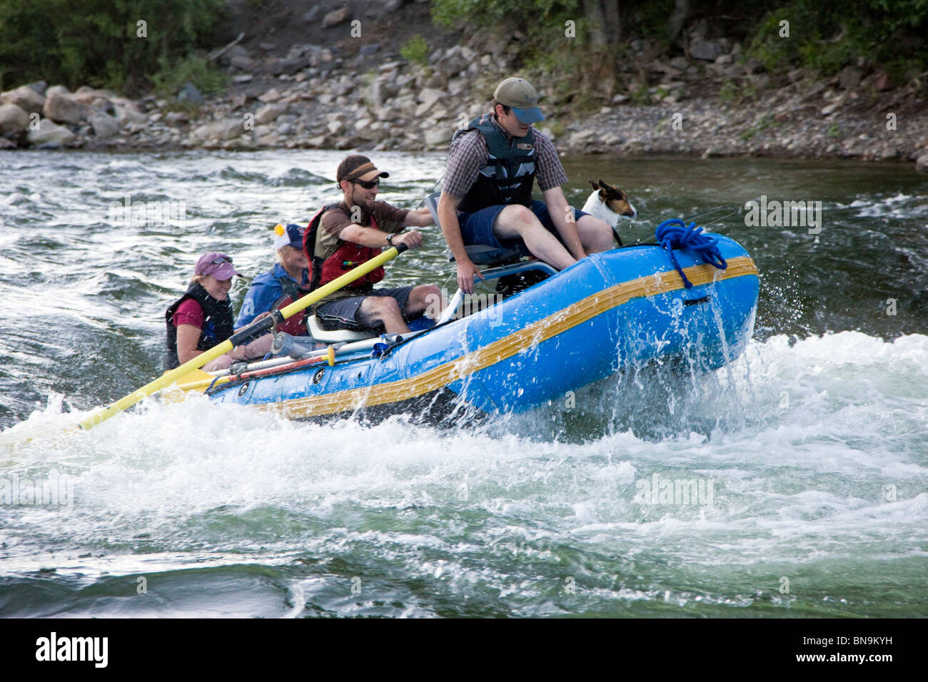 Rafters float down the Arkansas River through the small mountain town