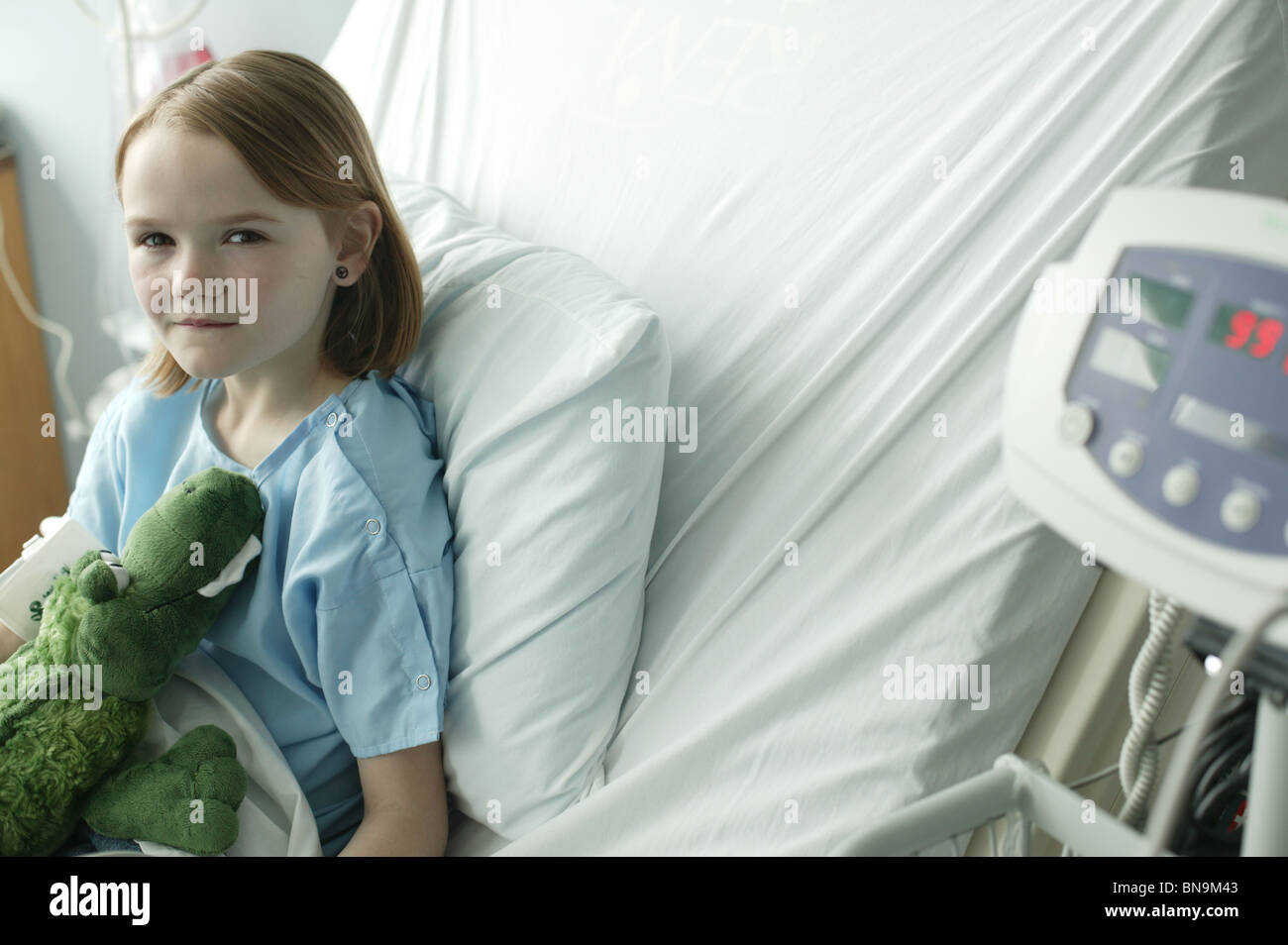 young girl in hospital bed Stock Photo