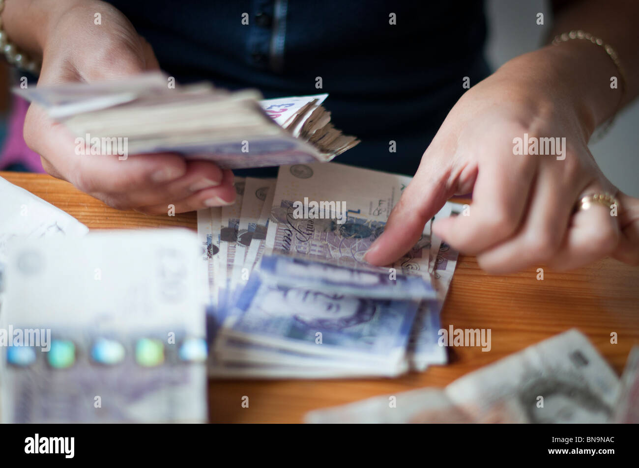 Person counting cash-close-up Stock Photo