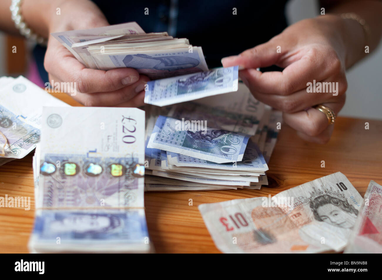 Person counting cash-close-up Stock Photo