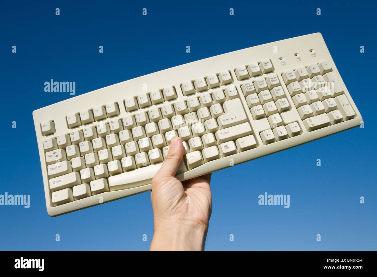 Computer Keyboard and blue sky, concept of freedom Stock Photo Alamy