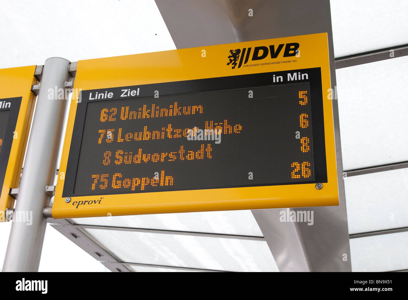 Information display at bus stop, showing times of arrival of next bus and tram, Dresden, Germany. Stock Photo