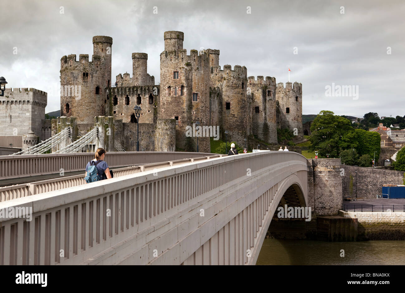 UK, Wales, Gwynedd, Conway Castle, with Telford’s suspension bridge and A55 road bridge Stock Photo