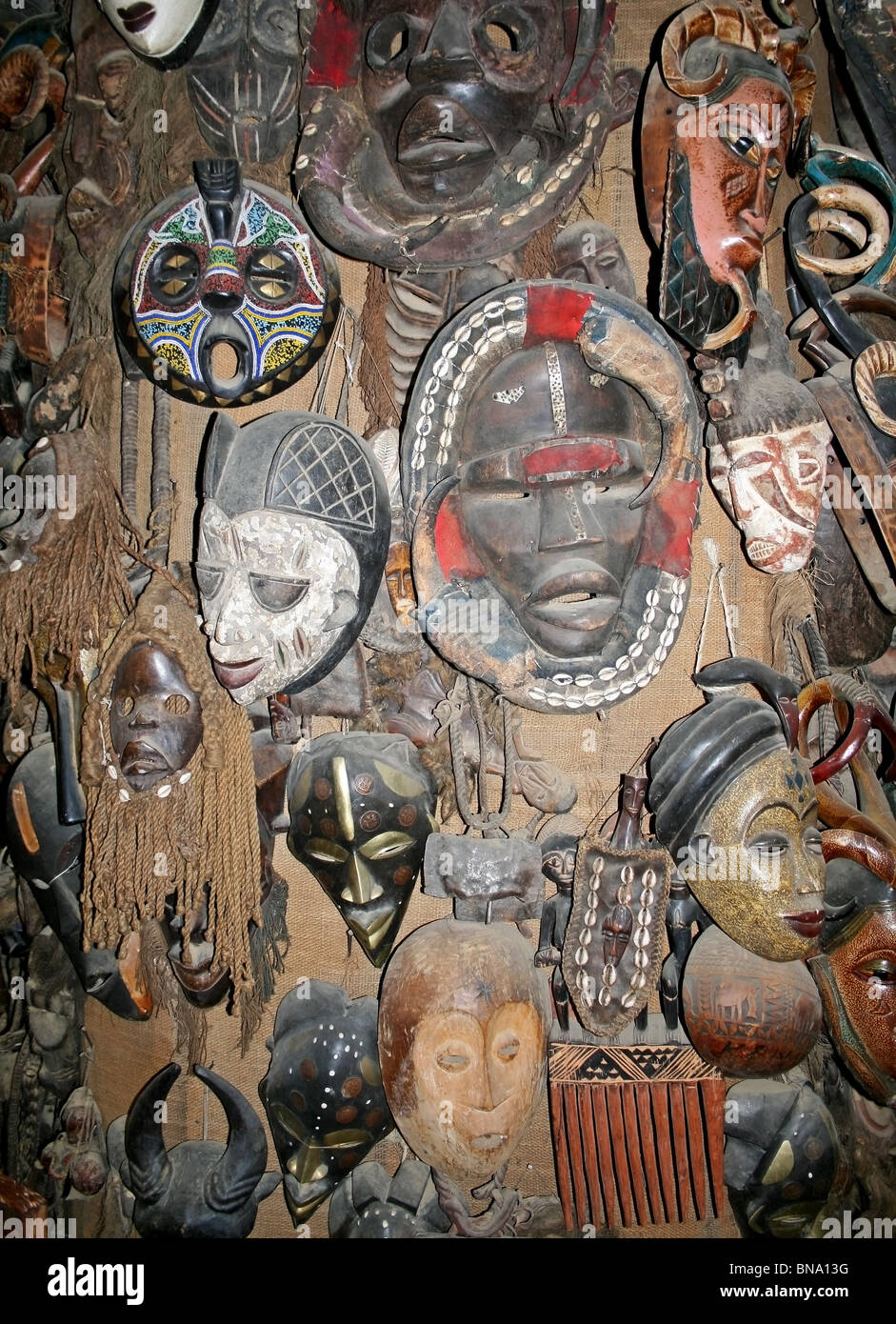 Masai wooden Masks and traditional craft items being sold at a souvenir shop near Masai Mara National Reserve Kenya, East Africa Stock Photo
