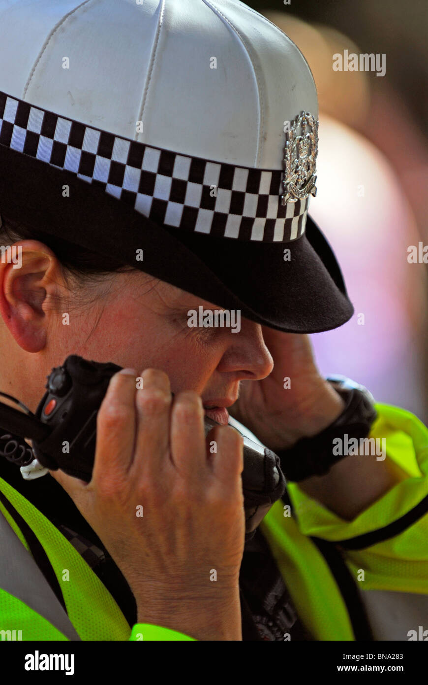 Police officer on radio at scene of a road traffic accident (RTA), Bordon, Hampshire, UK. Stock Photo