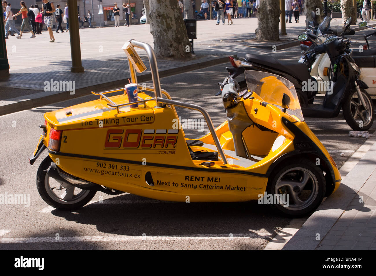 BARCELONA TRANSPORT FOR HIRE FOR TOURISTS SPAIN  EUROPE YELLOW GO CAR Stock Photo