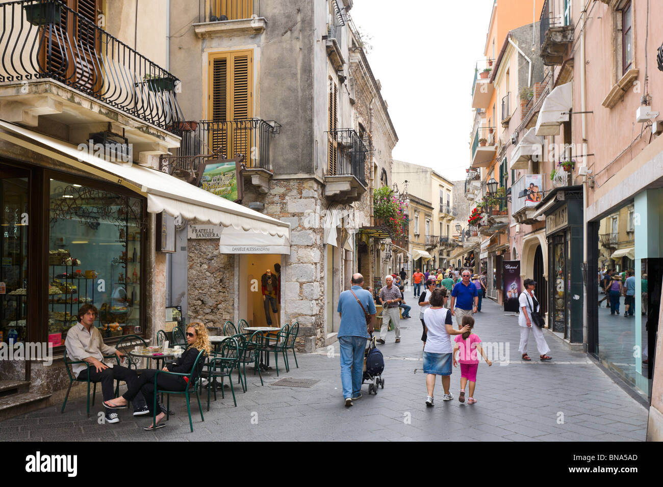 Cafe and shops on the Corso Umberto, the main street in the old town, Taormina, South East Coast, Sicily, Italy Stock Photo