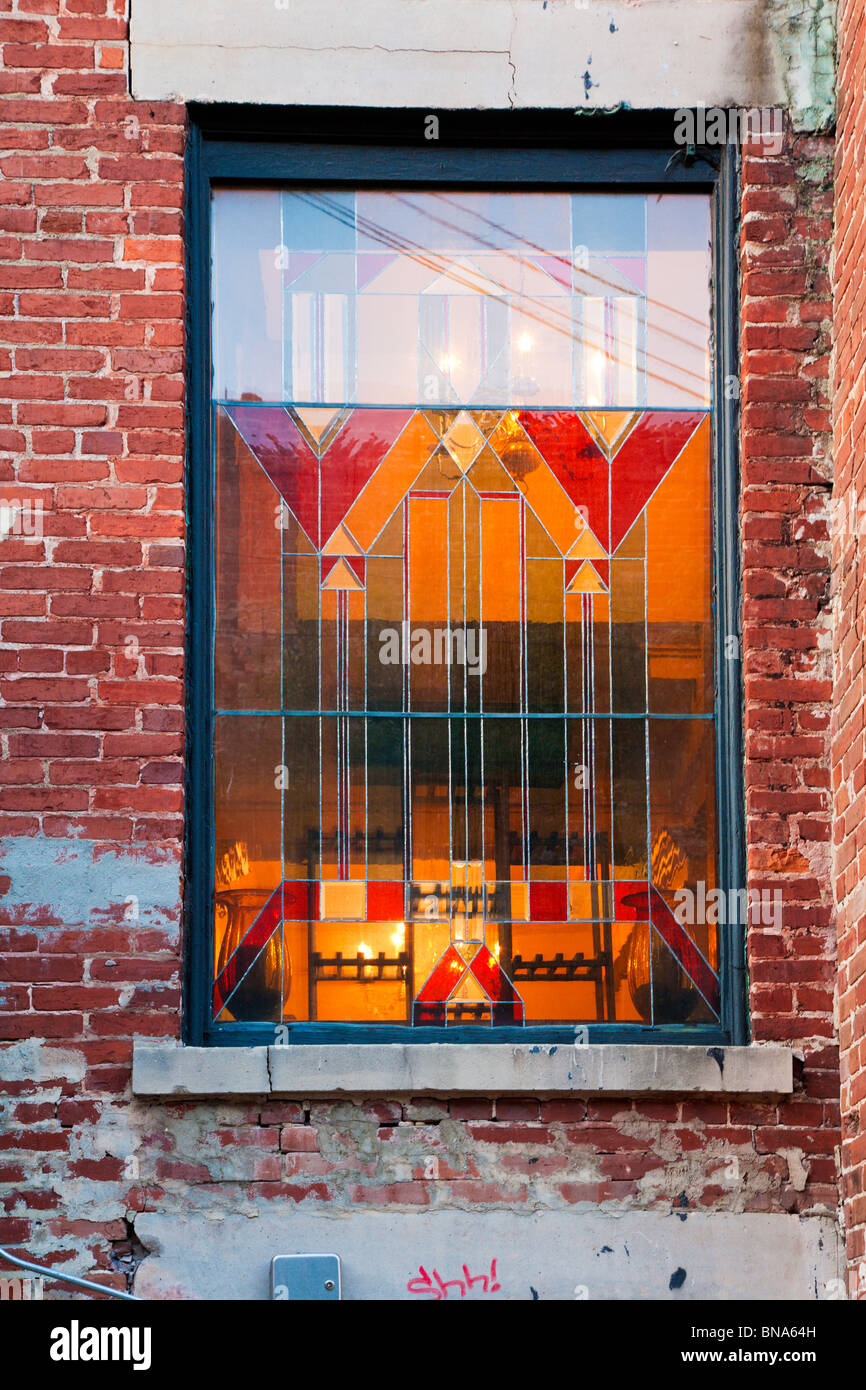 Ocala, FL Mar 2009 Old leaded stained glass window in rustic brick