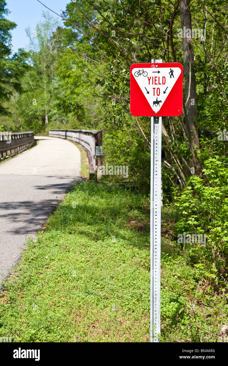 Right of way sign for hiking, biking and horse trails along Rails to Trails project to convert old railways to recreation areas. Stock Photo