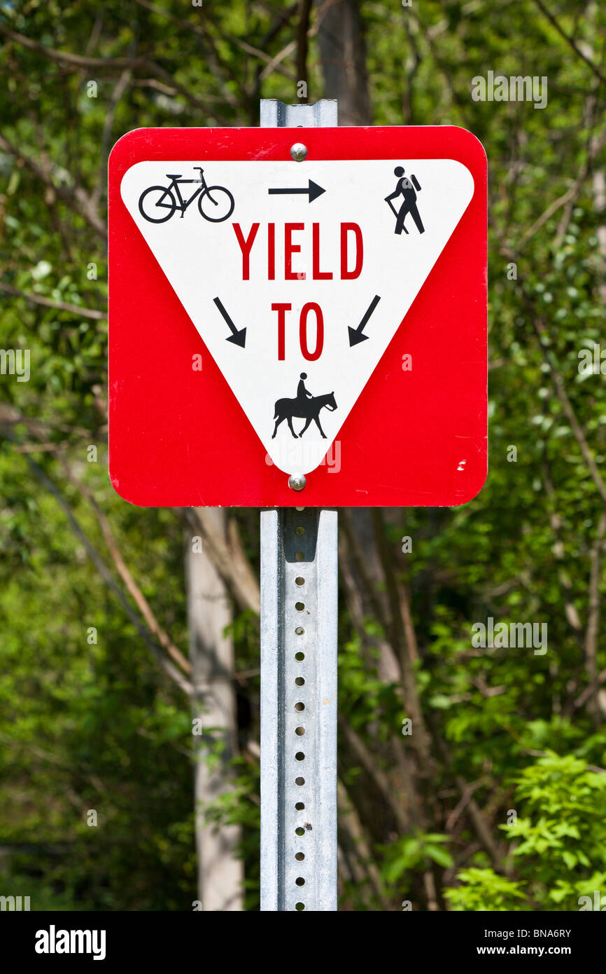 Right of way sign for hiking, biking and horse trails along Rails to Trails project to convert old railways to recreation areas. Stock Photo