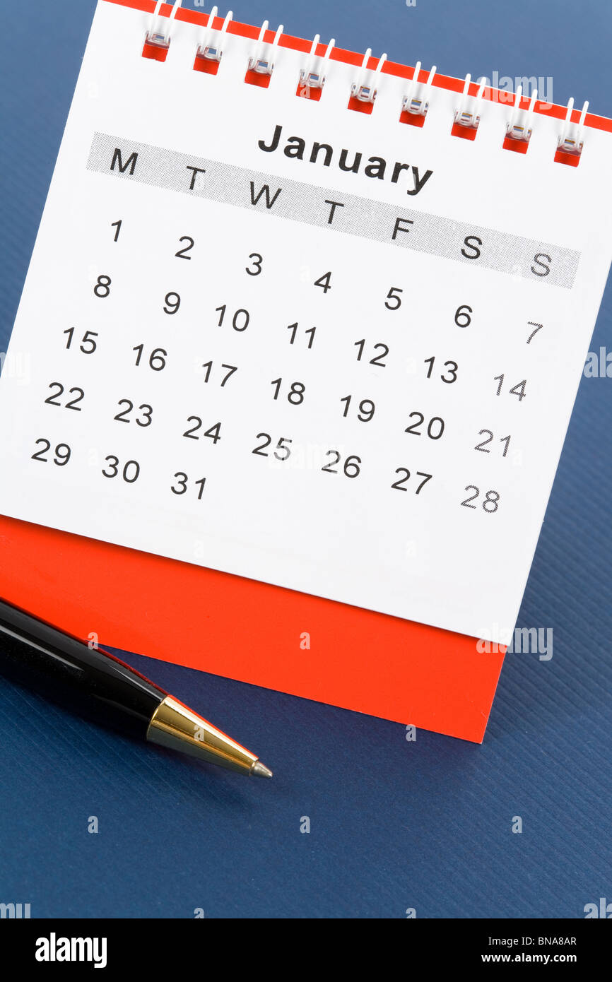 Calendar January close up with blue background Stock Photo - Alamy