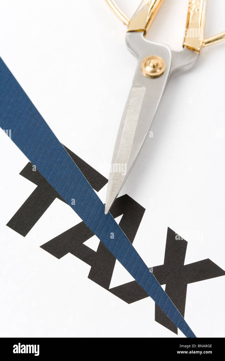 text of tax and scissors, concept of tax cut Stock Photo