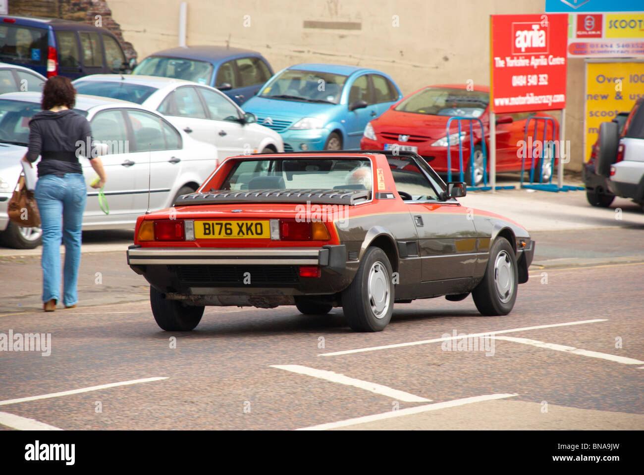 Fiat X1/9 driving through Lockwood, Huddersfield. Stock Photo