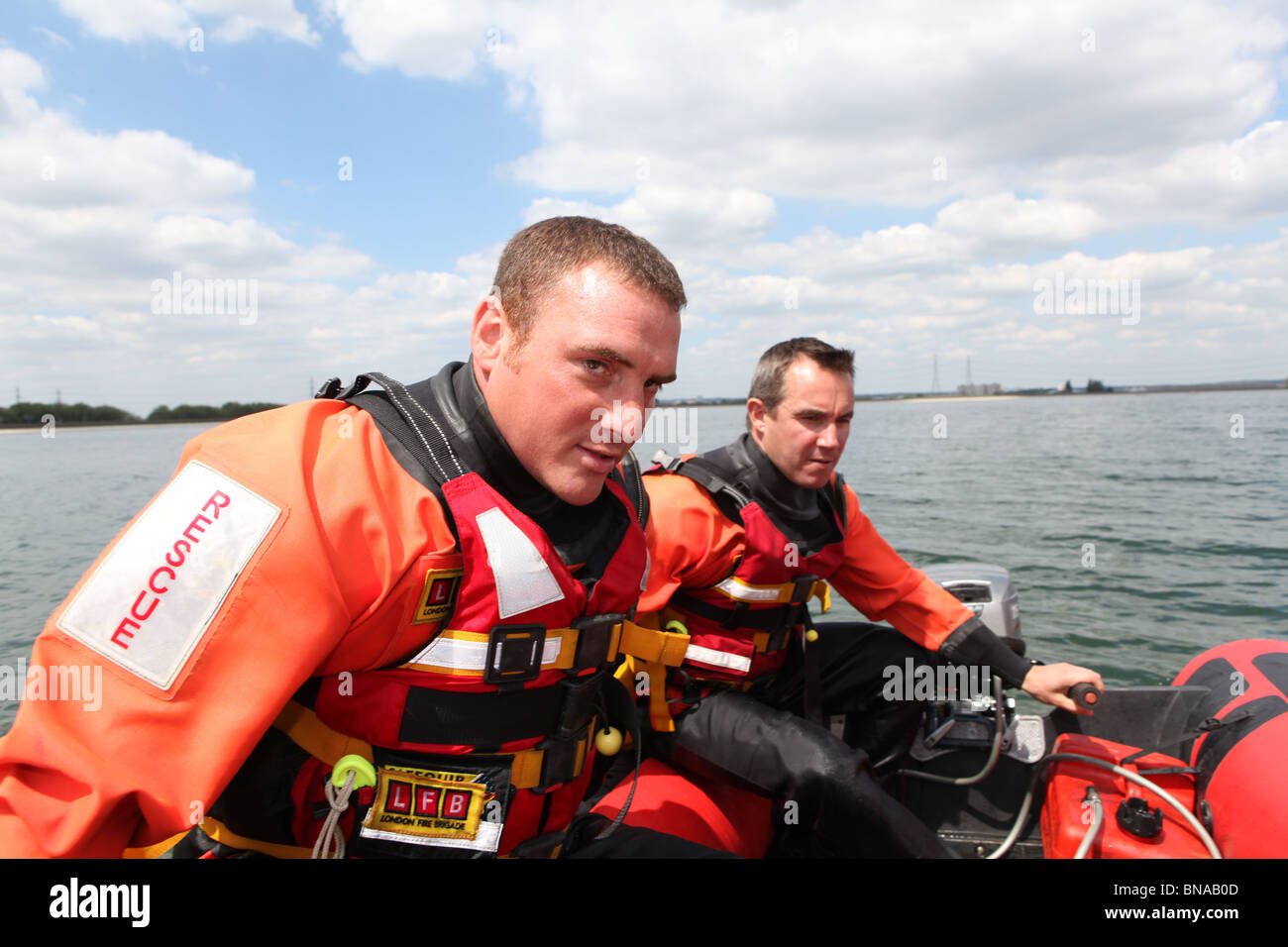 Firemen using hose hi-res stock photography and images - Alamy