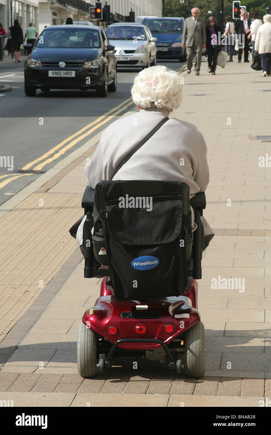 Woman on electric wheelchair in Leamington Spa, Warwickshire, England