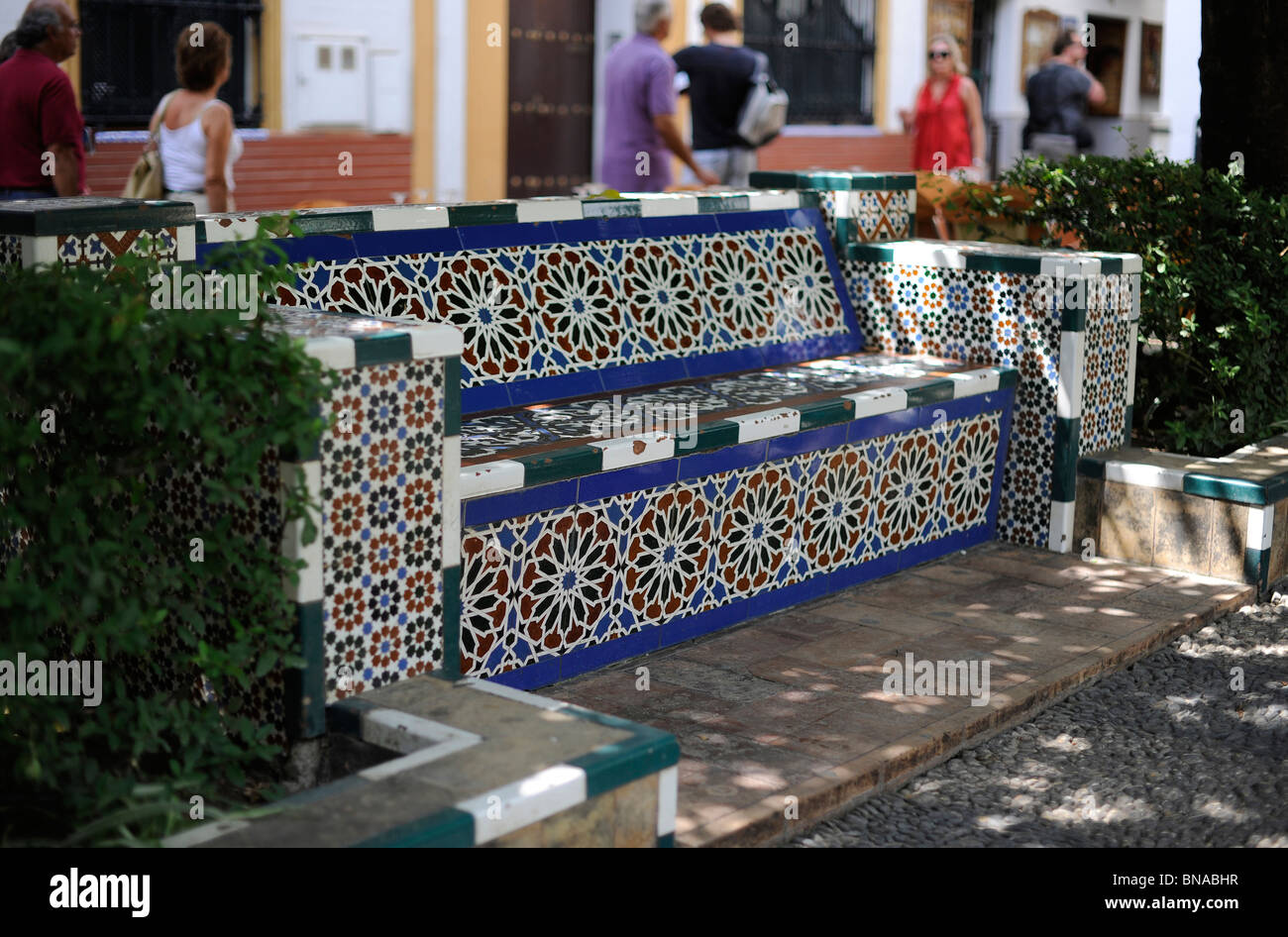 park bench with colorful glazed tile seen in Sevilla Stock Photo
