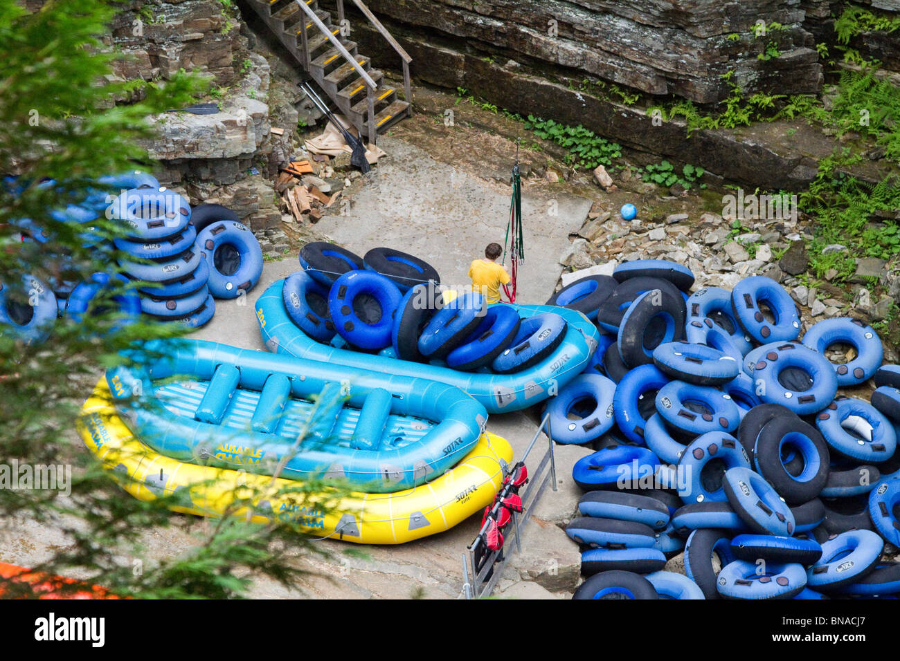 Rubber rafts, life vests and tubes for floating down the Ausable Chasm in the Adirondack State Park of New York. Rafting Stock Photo