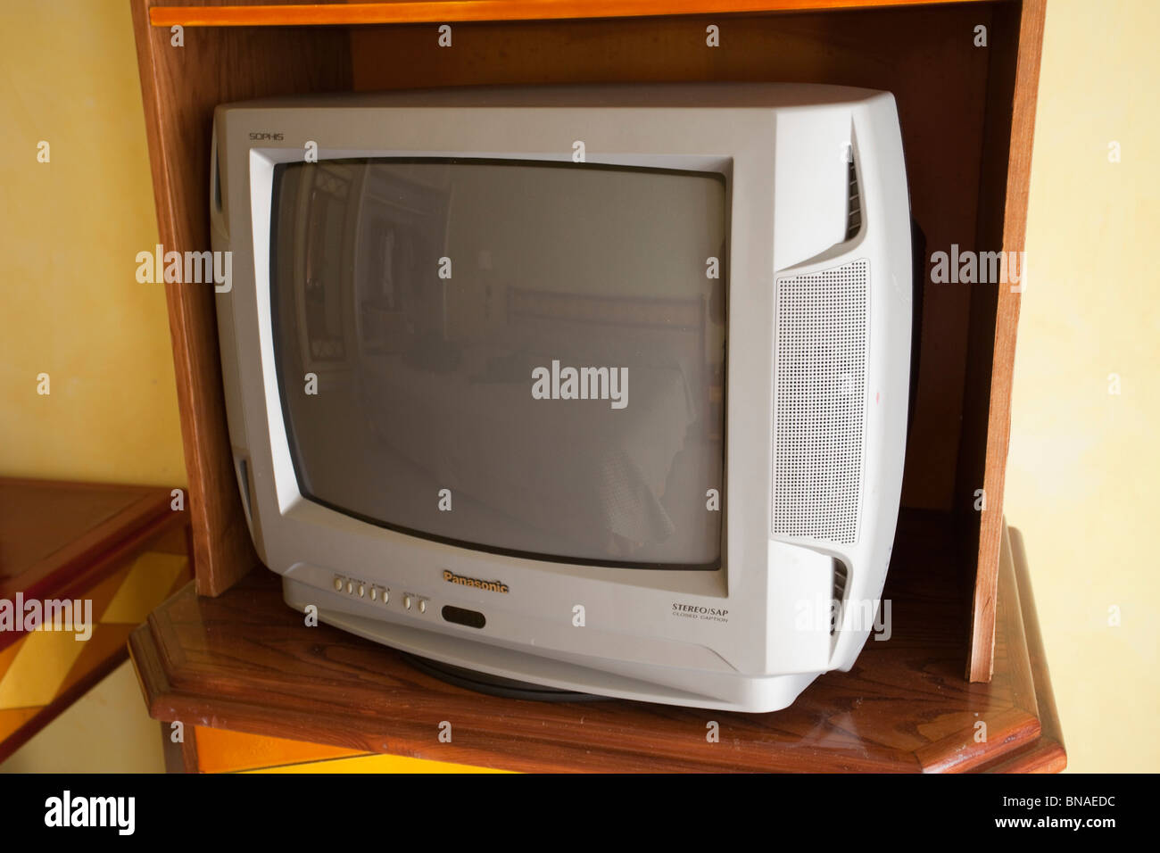 old CRT television in hotel room. Stock Photo