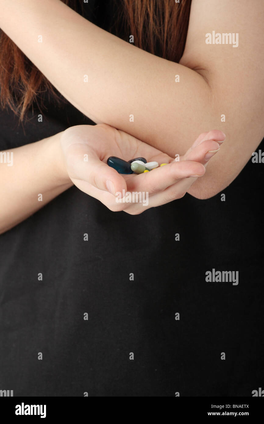 Hands of a young woman holding prescription drug Stock Photo - Alamy