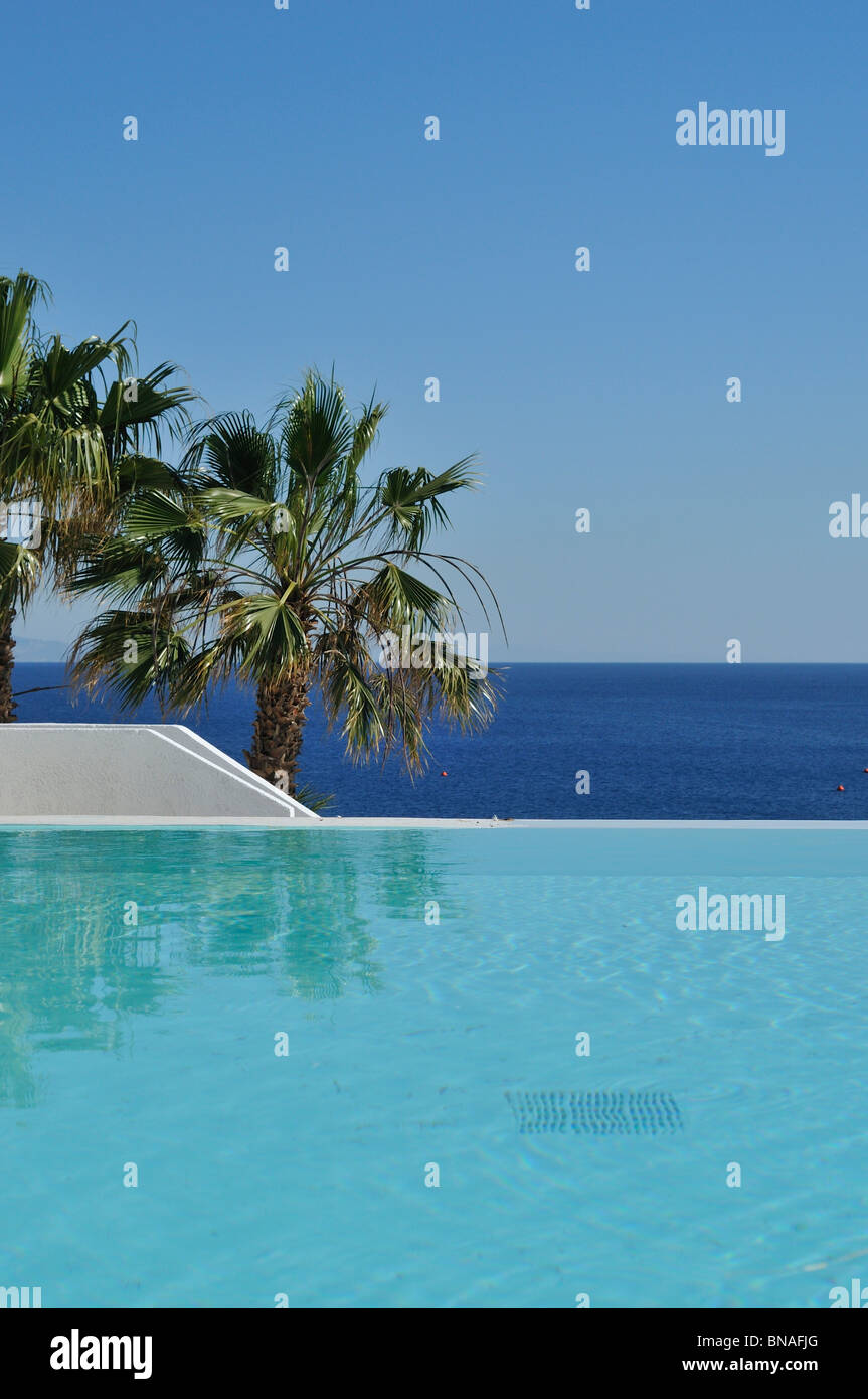 Mykonos. Greece. Infinity pool at Hotel Mykonos Blu, Psarou Beach. Stock Photo