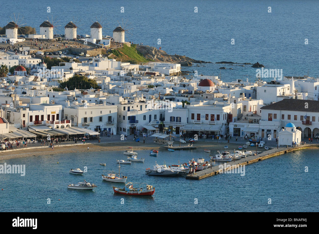 Mykonos. Greece. View of whitewashed buildings, windmills and the port of Hóra (Mykonos Town). Stock Photo