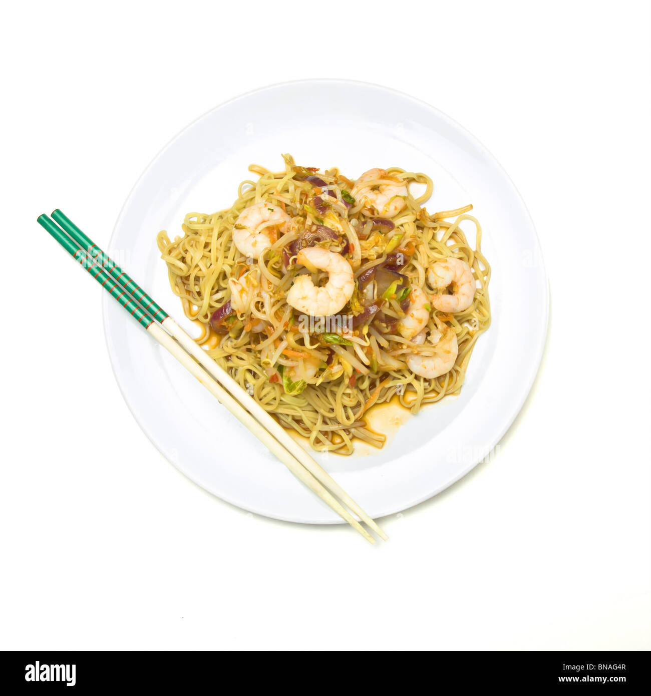 Prawn Stir fry on white plate isolated against white background. Stock Photo