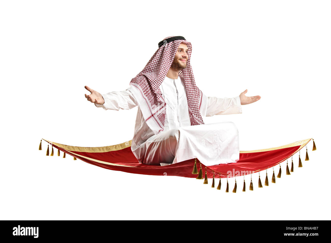 An Arab person sitting on a flying carpet Stock Photo