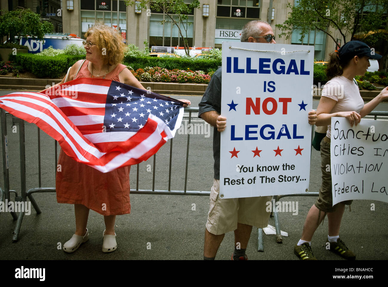 Counter protesters across from a pro-immigrant group rally in front of Major League Baseball's offices on Park Ave. in New York Stock Photo