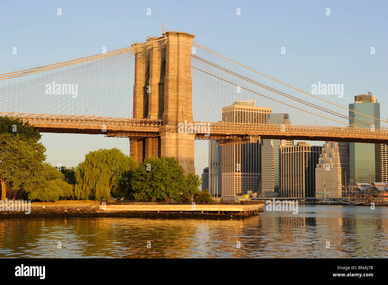 Base of the Brooklyn bridge photographed in the golden light of the