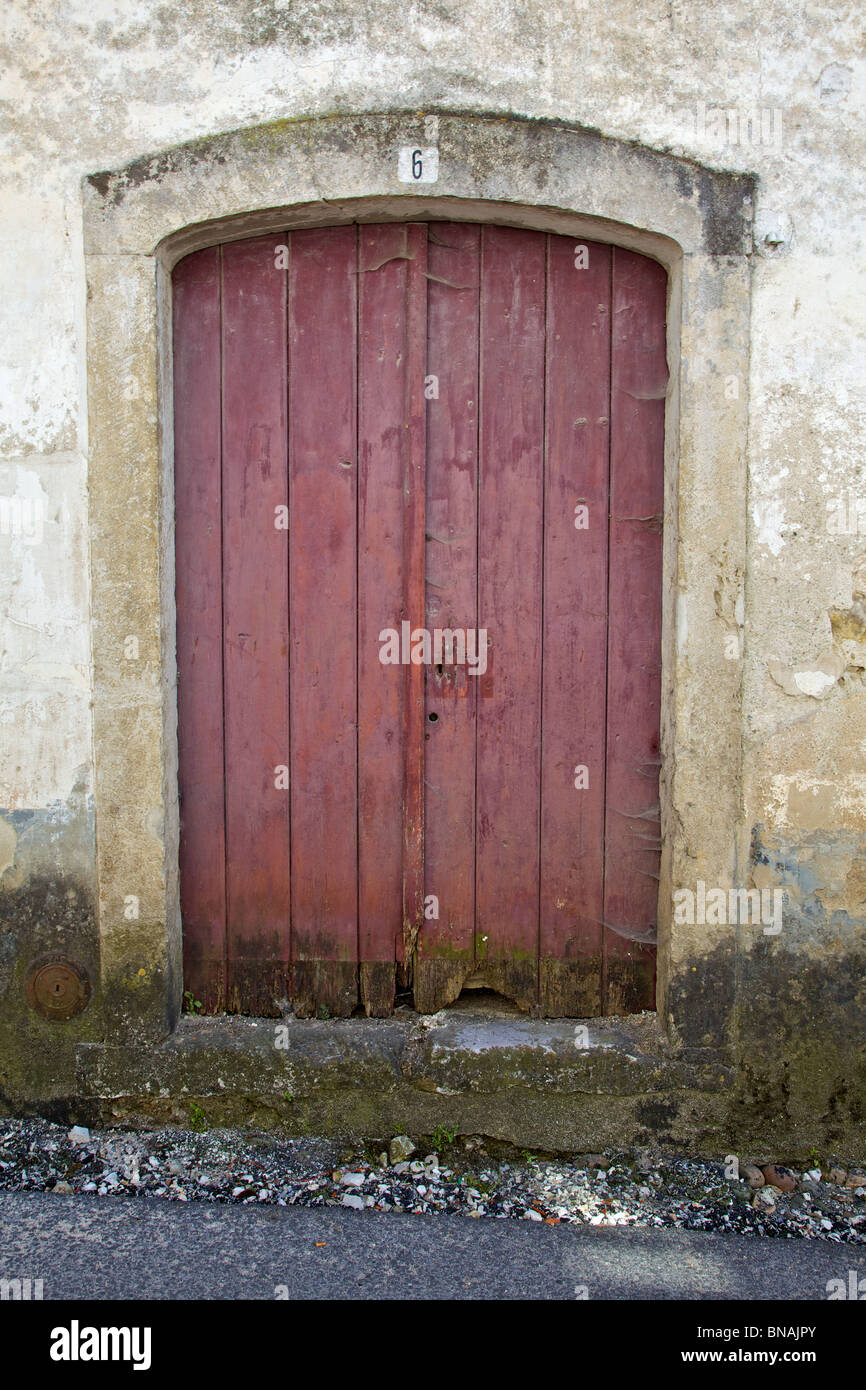 Rustic Red Wood Door of the Medieval Village of Pombal Stock Photo