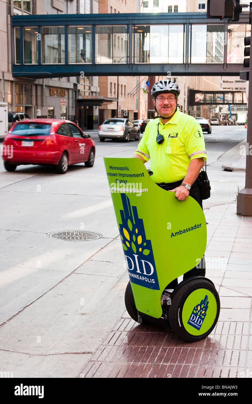 A DID ambassador rides a segway vehicle in downtown Minneapolis. Stock Photo