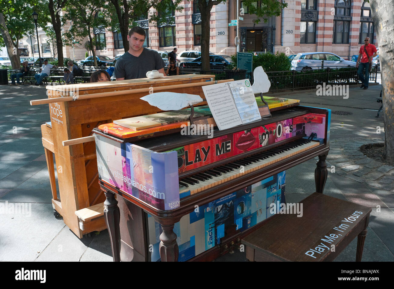 New York, NY - 2 July 2010 - Play Me I'm Yours. Dual pianos in TriBeCa Park. ©Stacy Walsh Rosenstock/Alamy Stock Photo