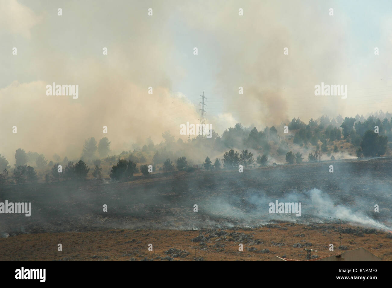 Smoke arises over the outskirts of Israeli city of Kiryat Shmona following Katyusha rockets attack by Hezbollah from Lebanon during Israel - Hezbullah war Stock Photo