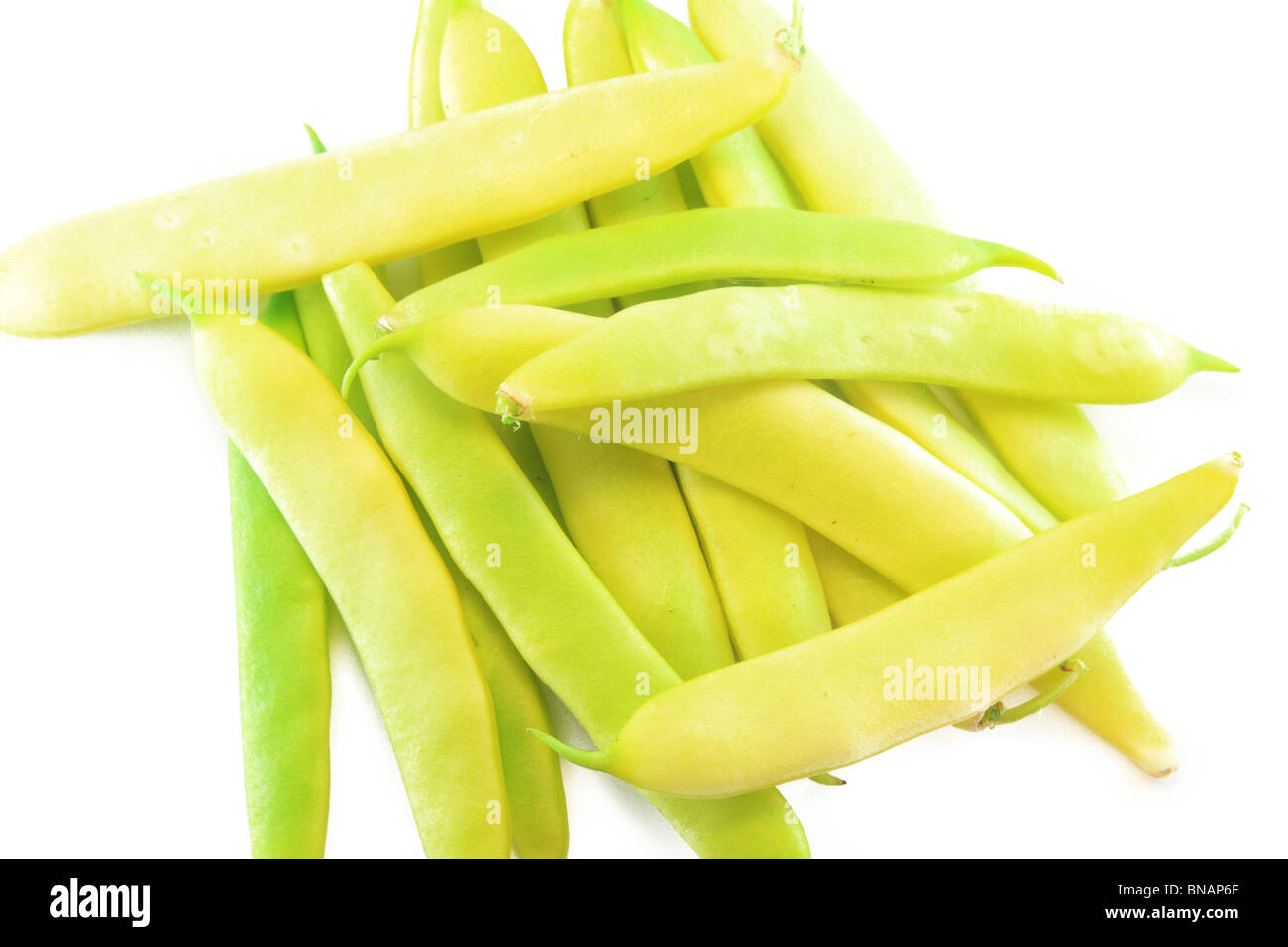 Pile of yellow wax bean pods isolated on the white background Stock Photo
