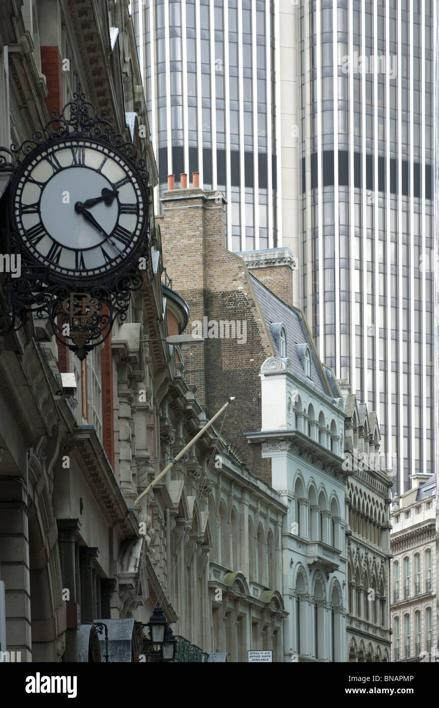 A clock reads 2.22 on the front of a building in the City of London. Stock Photo