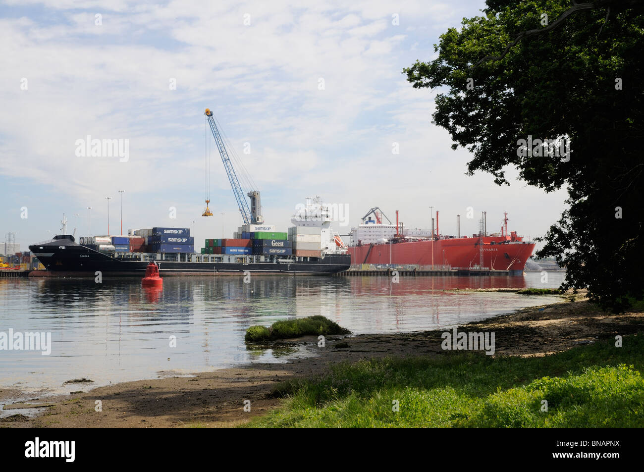 Port of Southampton viewed across Southampton Water and English countryside southern England UK Stock Photo