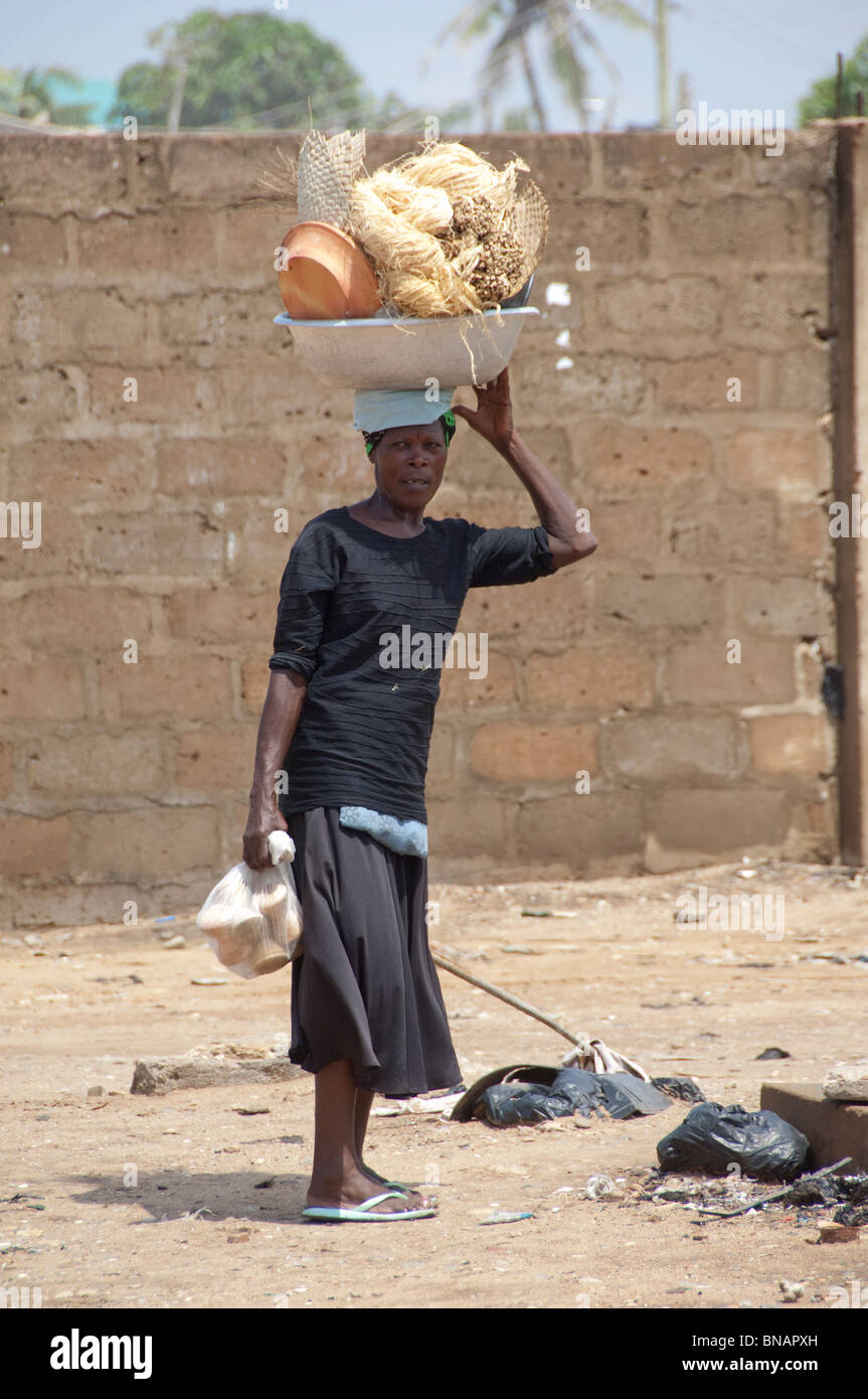 Africa, Ghana, Accra. Local woman with load on her head. Stock Photo