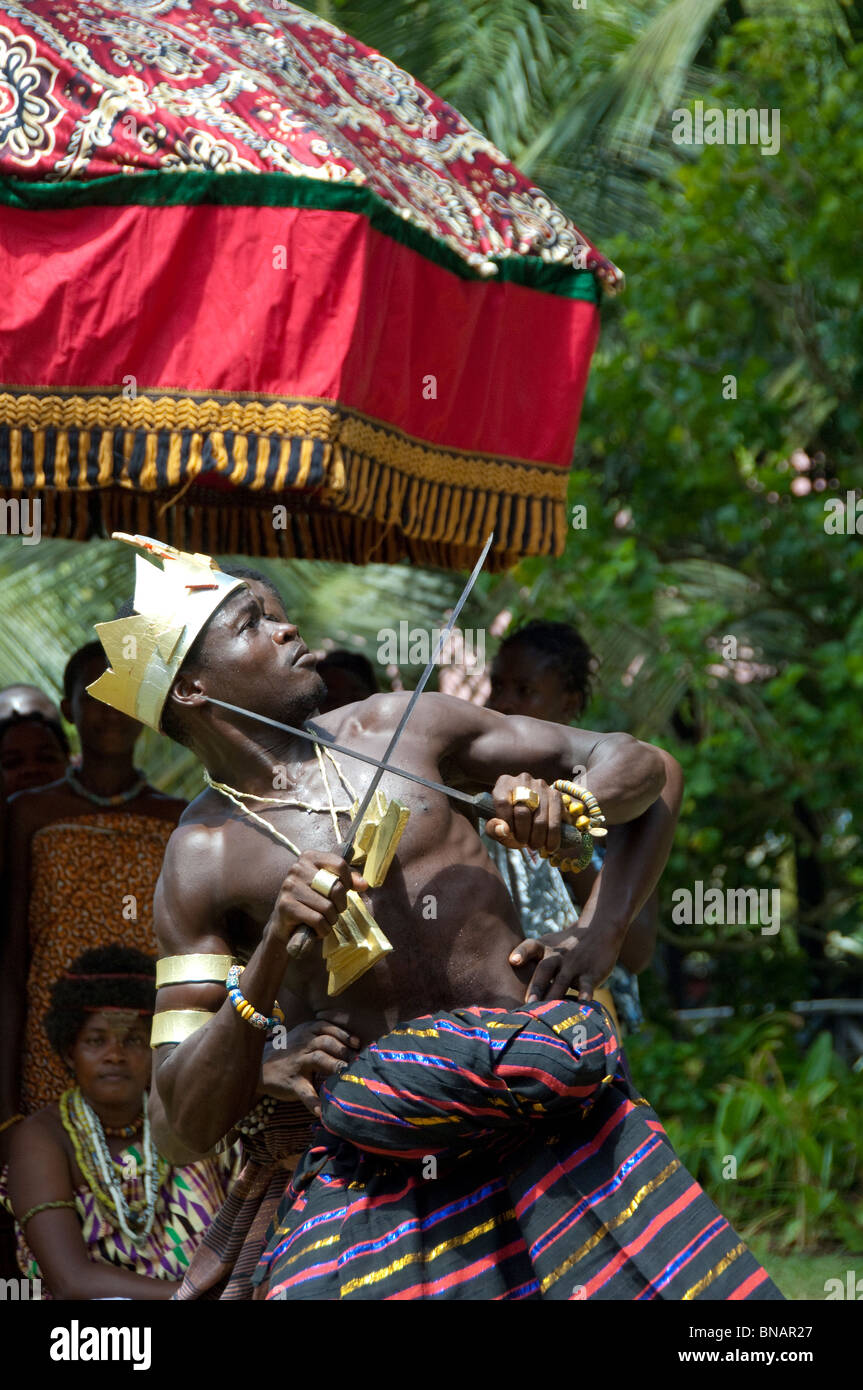 Africa, Ghana, Accra. La Palm Beach Hotel. Traditional West African folkloric show. Ceremonial dancer with knife. Stock Photo