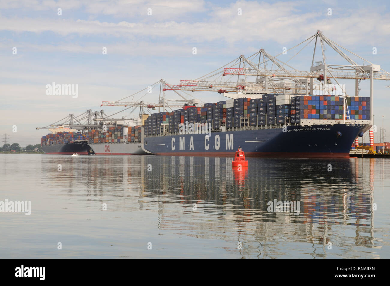 One of the worlds largest container ships the CMA CGM Christophe Colomb on the quayside at DP World Southampton England UK Stock Photo