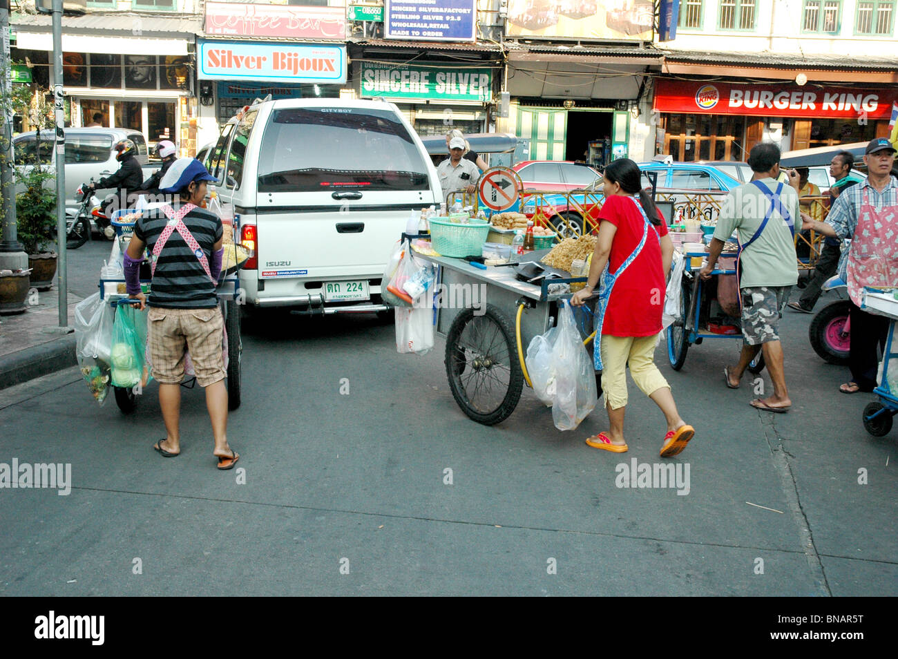 Unlicensed Street Food Vendors retreat temporarly during police crack down- Bangkok Thailand Stock Photo