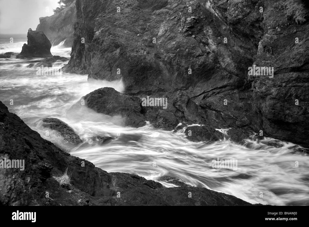 Wave action and rocky shoreline at Samuel H. Boardman State Scenic Corridor. Oregon Stock Photo