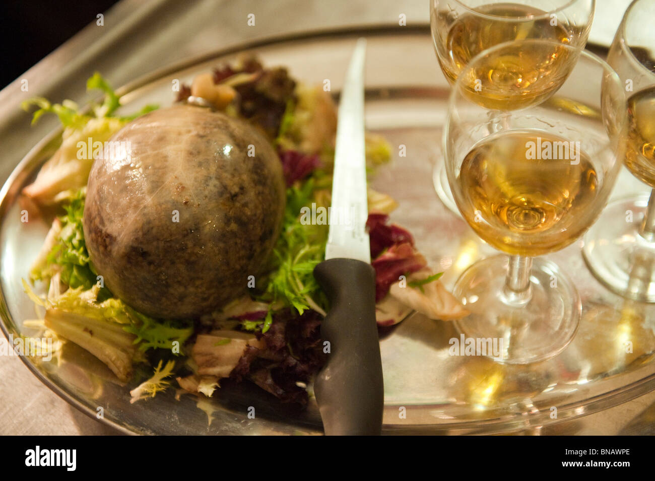 A tray with haggis and glasses of whisky at Burn''s supper night Stock Photo