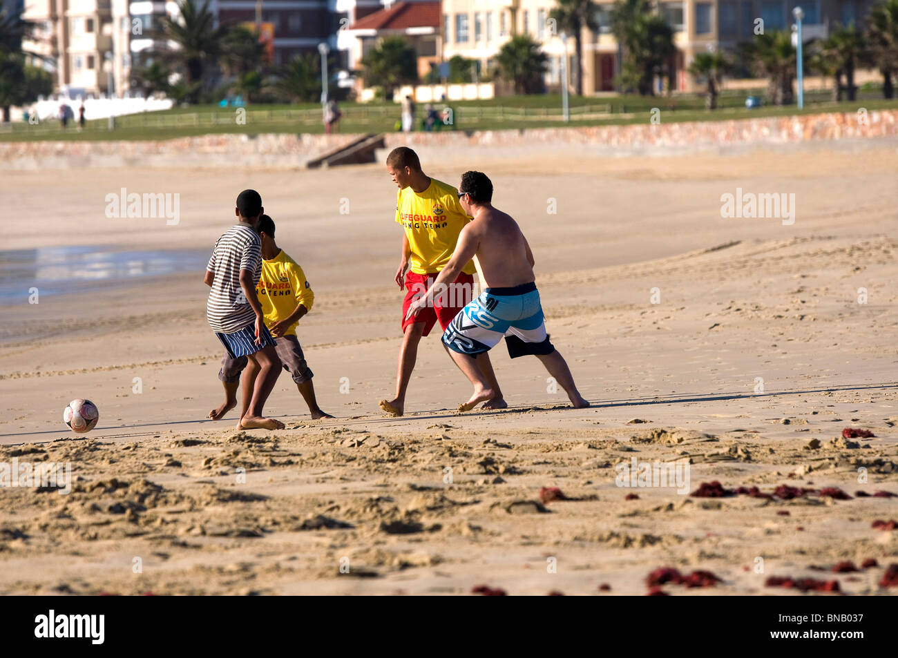 Informal football game by life guards  on Hobie Beach Port Elizabeth South Africa after the Soccer World Cup is over Stock Photo