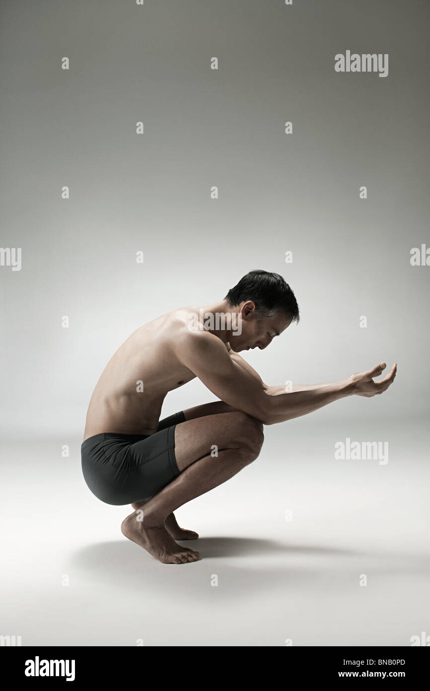 Man Crouching Down Hi Res Stock Photography And Images Alamy