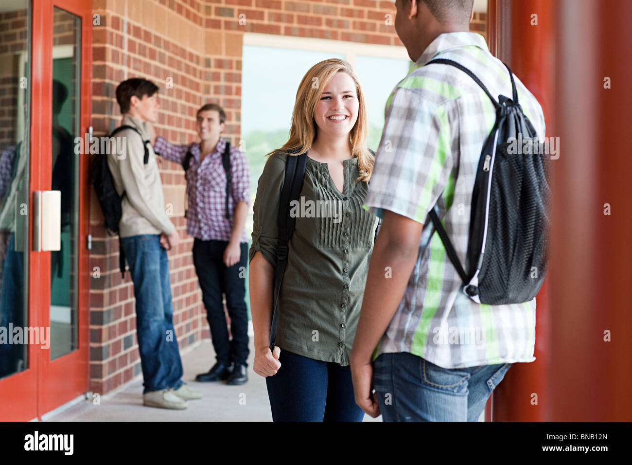 High school classmates chatting stock photo alamy