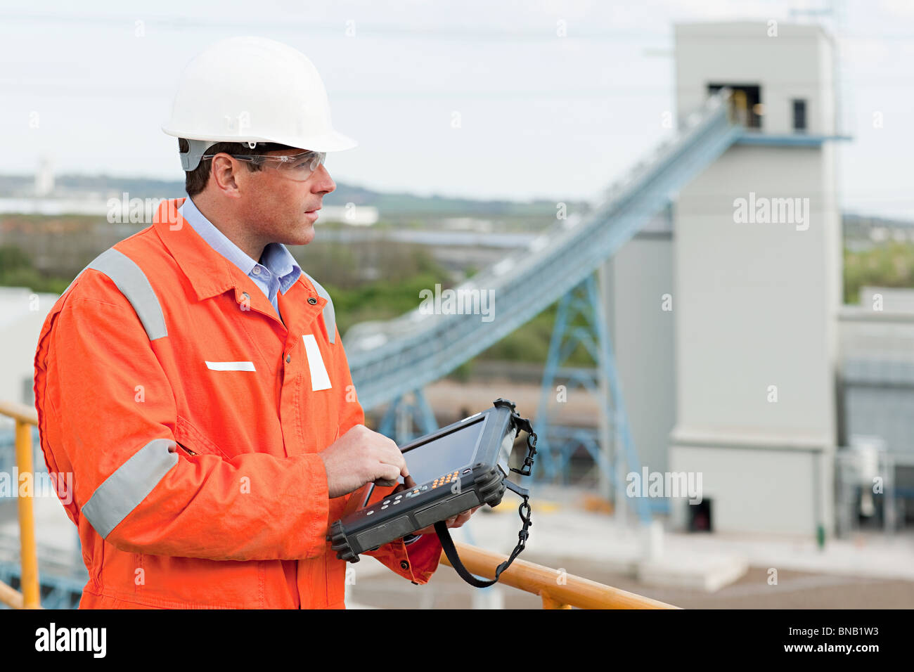 Engineer with handheld computer Stock Photo